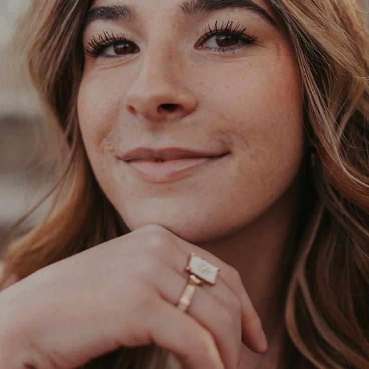 Kaveri Mehta, Lead Design Curator at DuneGardenOrion, reviewing corporate floral arrangements